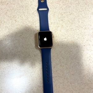 42MM Apple Watch with navy band and gold case